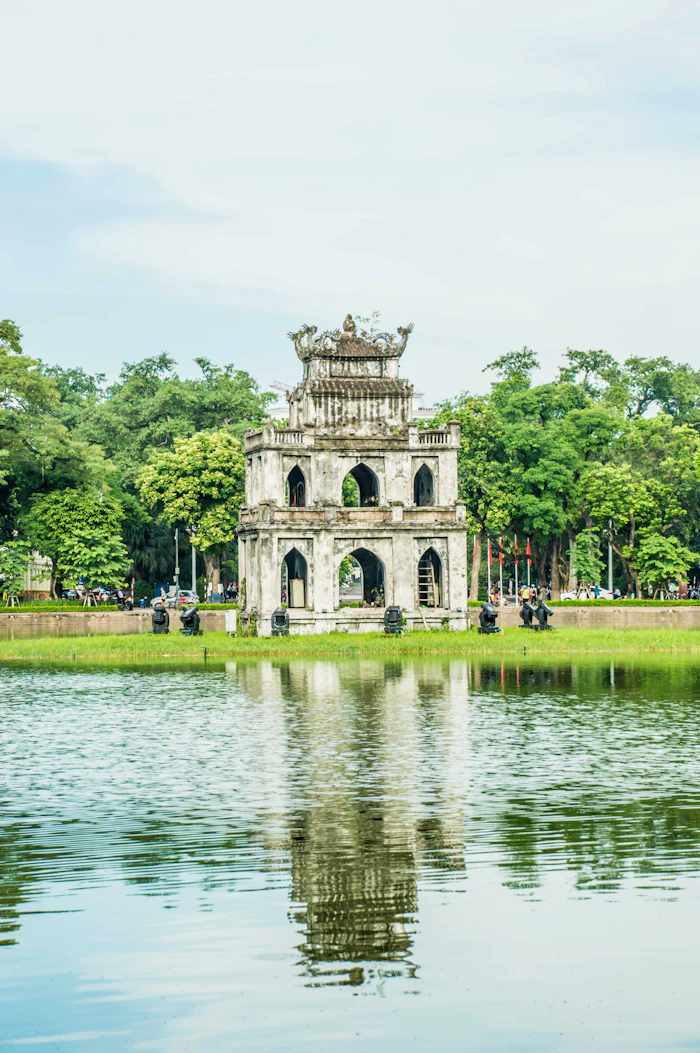 The Turtle Tower on Hoan Kiem Lake in central Hanoi, reflected in the water